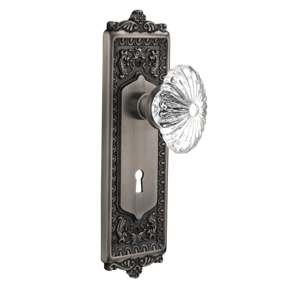 Nostalgic Warehouse EADOFC Privacy Knob Egg and Dart Plate with Oval Fluted Crystal Knob with Keyhole in Antique Pewter